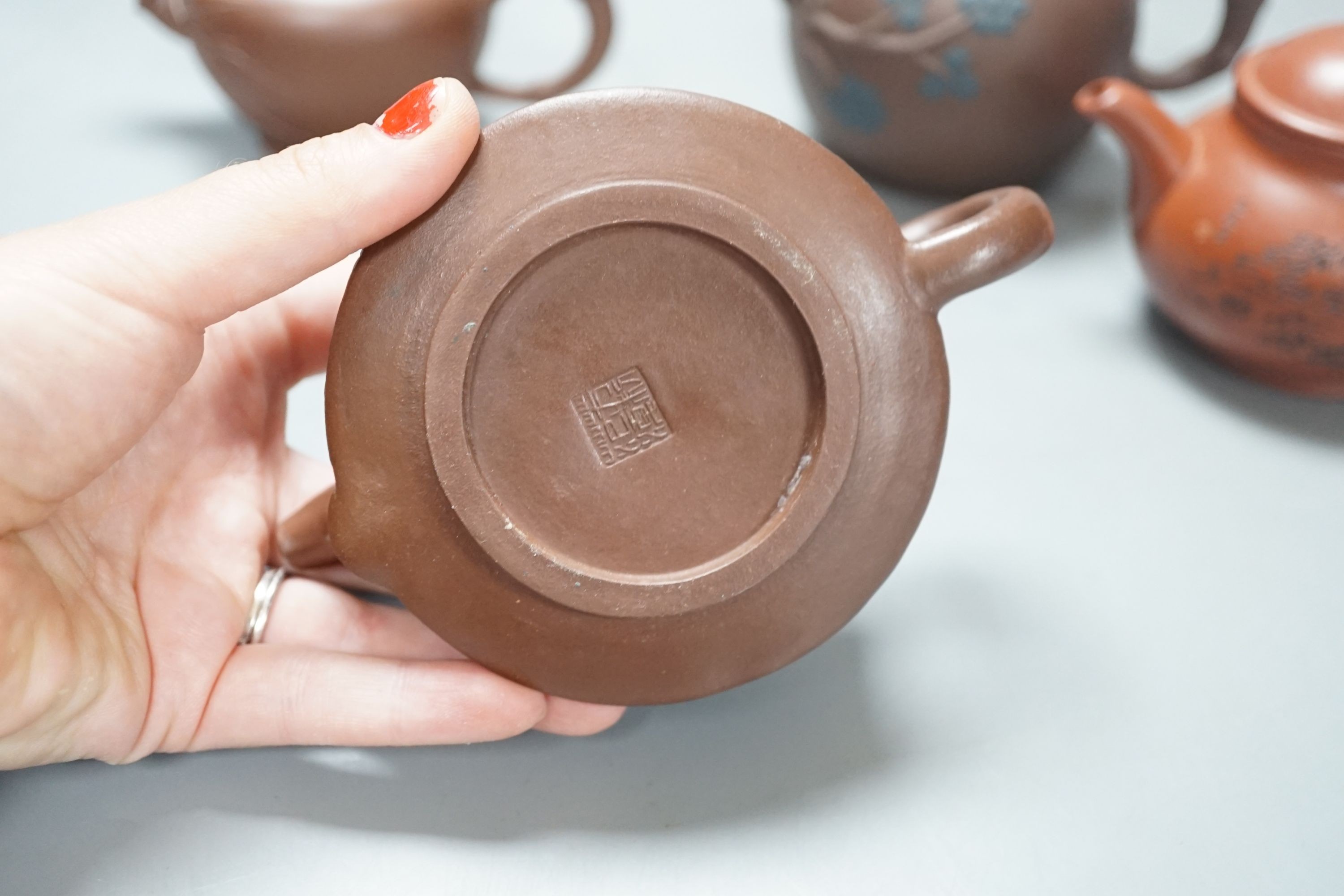 A group of four Yixing pottery teapots - tallest 11cm